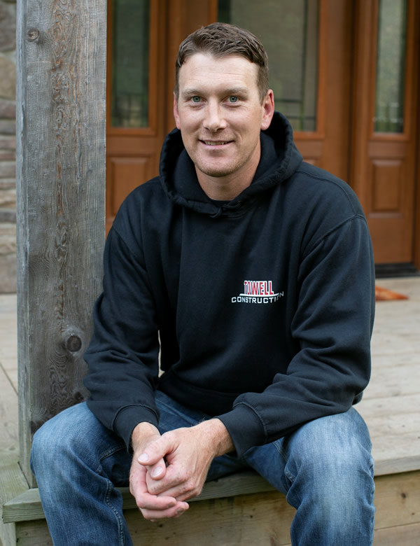 Owner, Chris Towell sitting on a porch